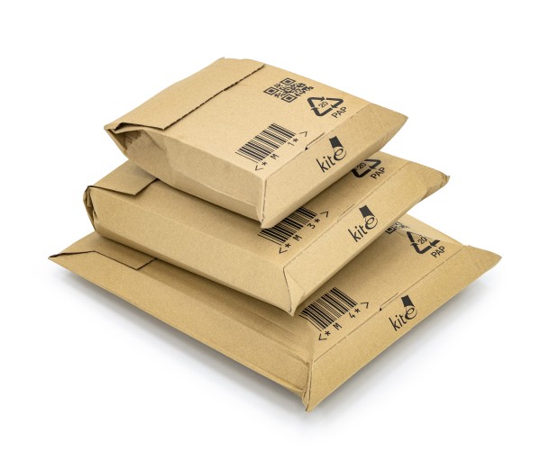 pile of three cardboard mailers with goods inside